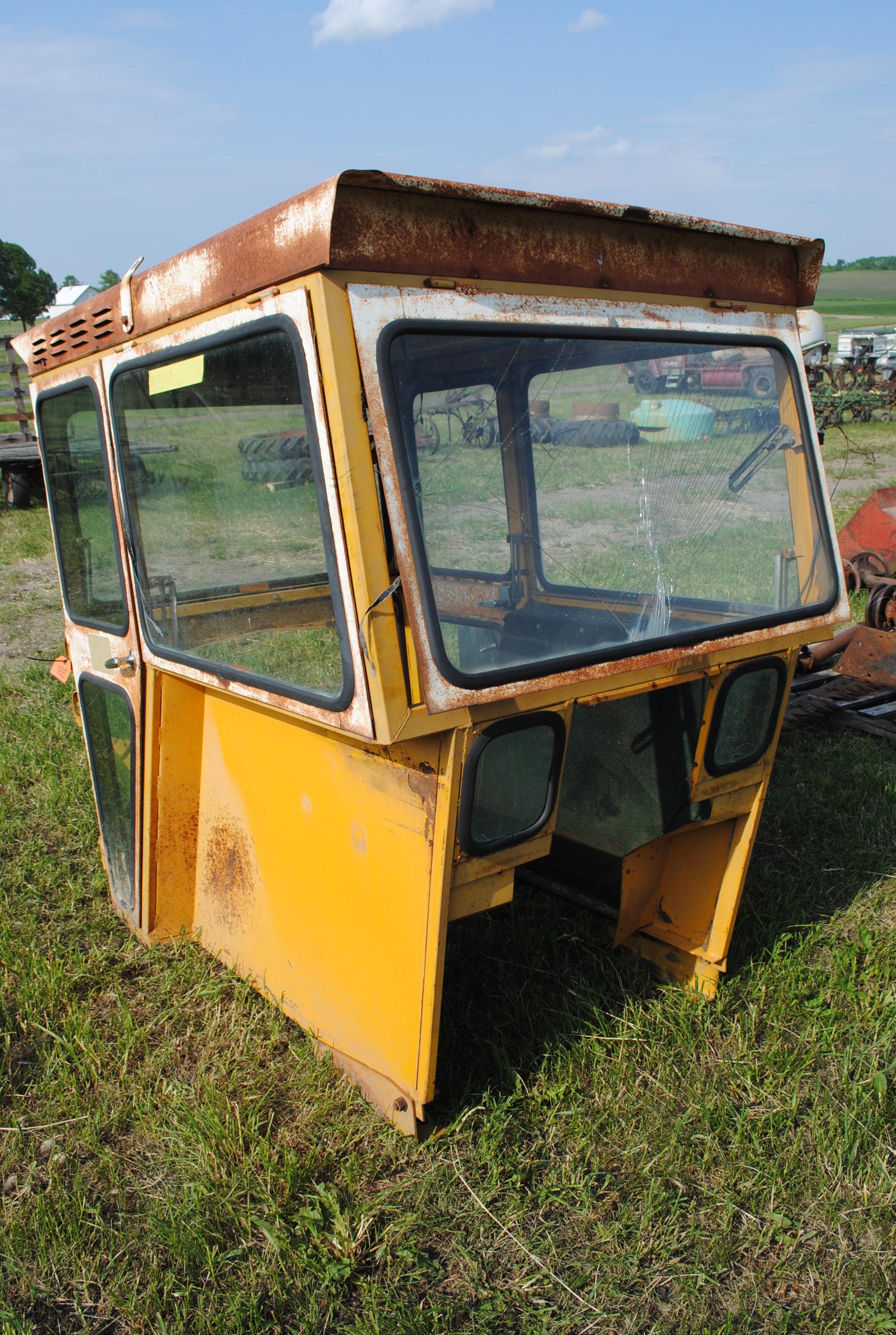 Tractor cab, broken back window
