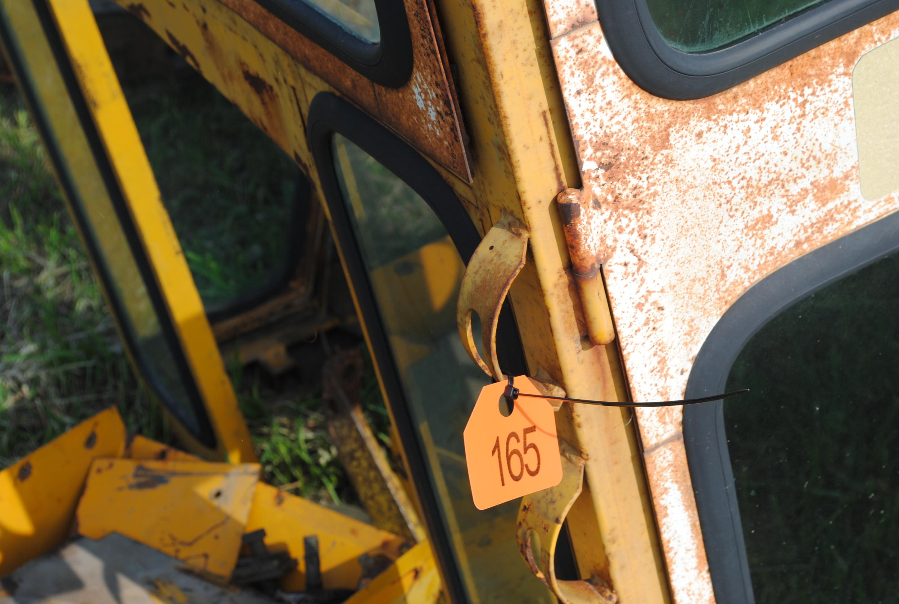 Tractor cab, broken back window