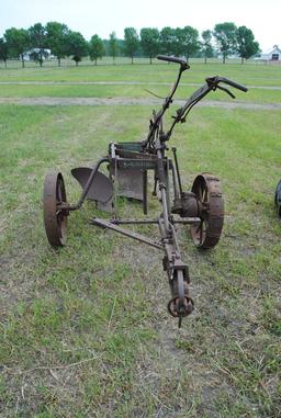 John Deere 2-14 pull-type plow on steel