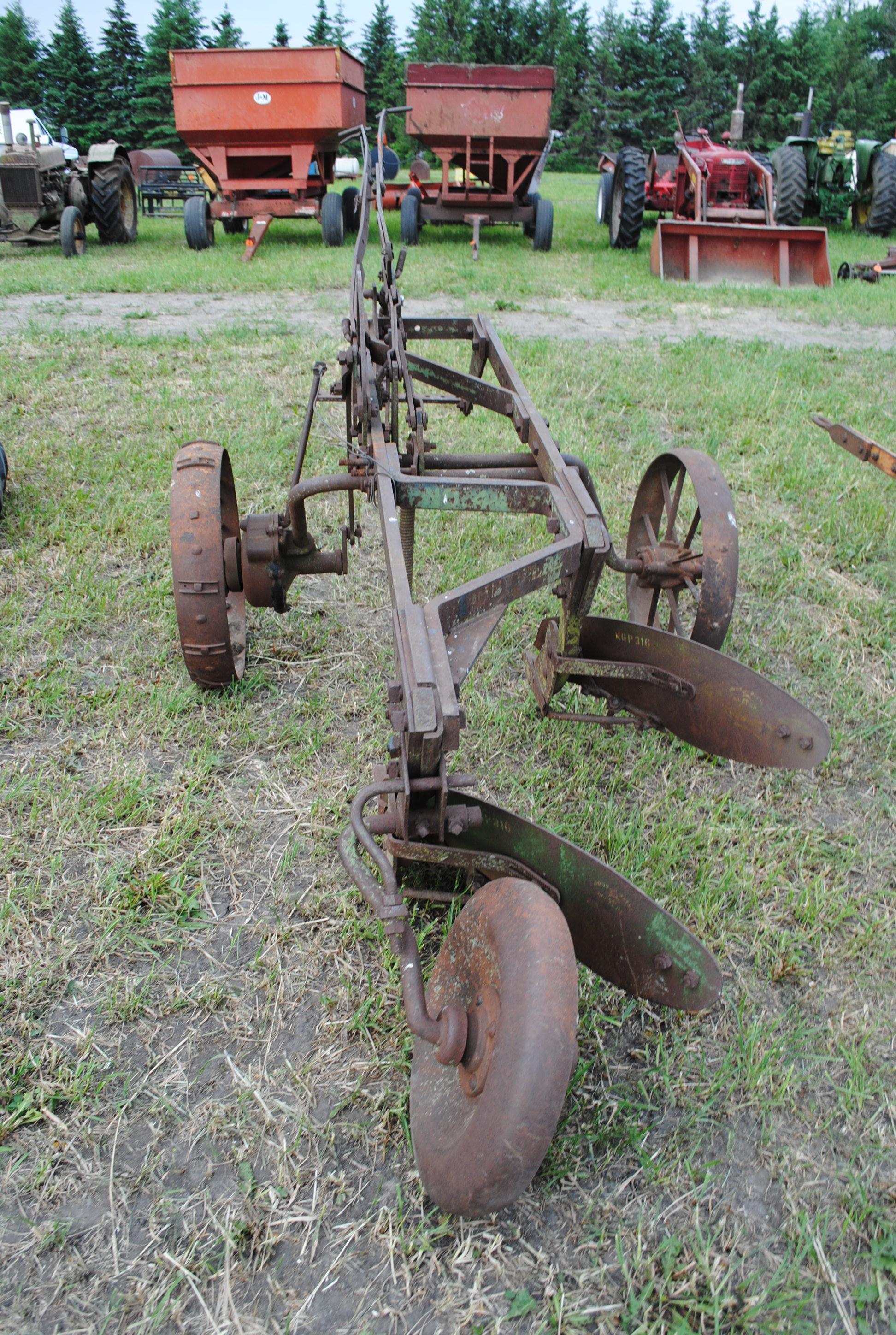 John Deere 2-14 pull-type plow on steel