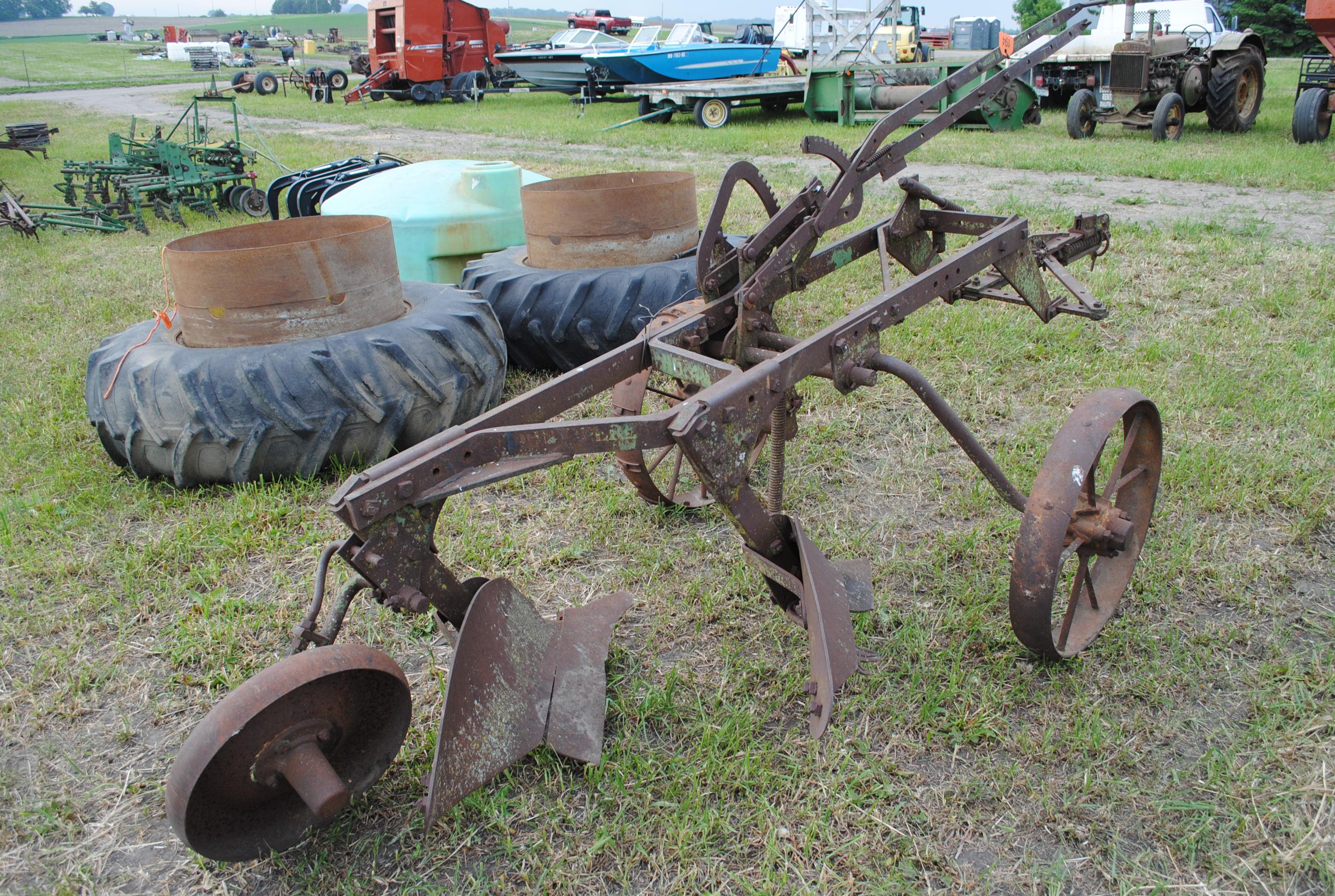 John Deere 2-14 pull-type plow on steel