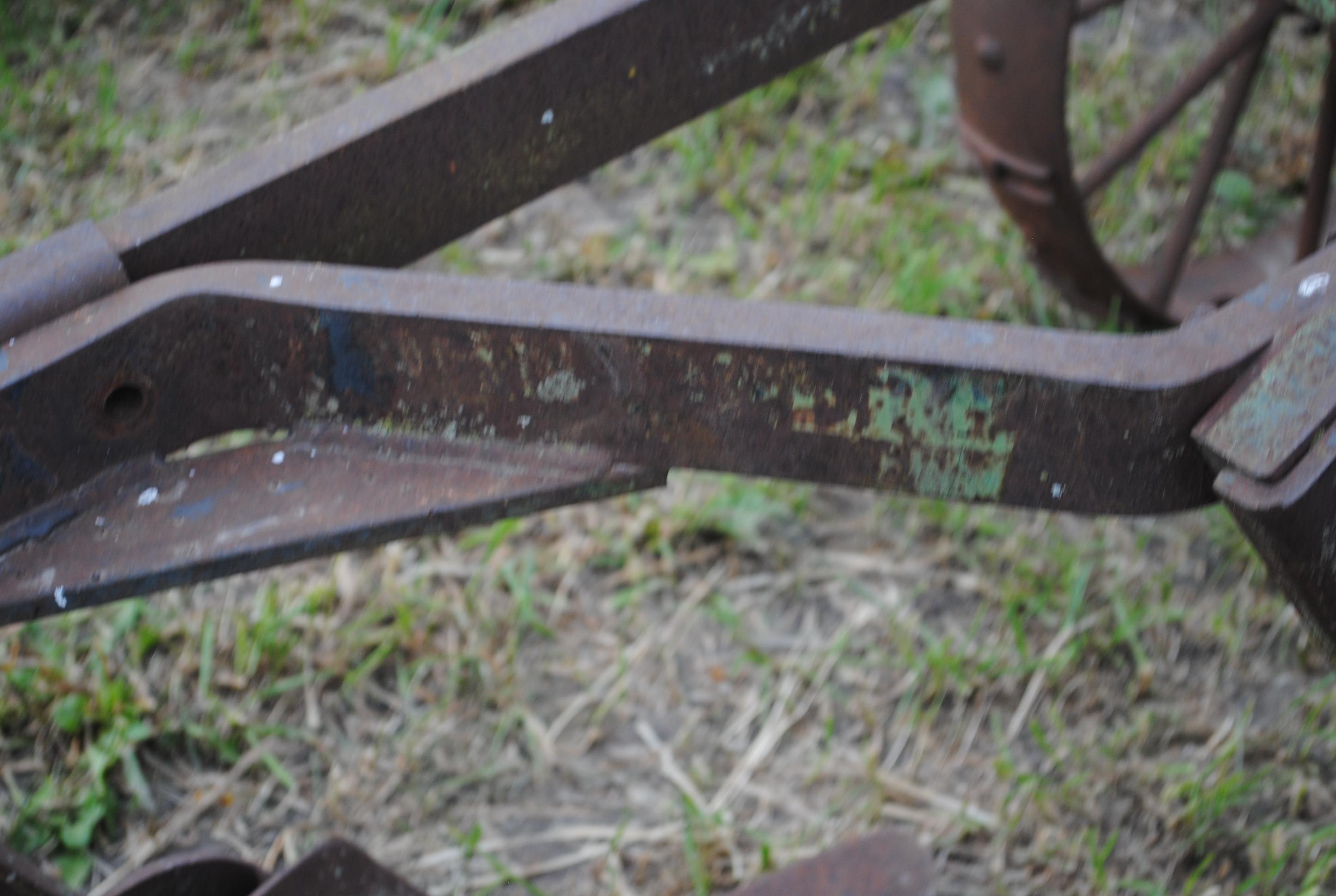 John Deere 2-14 pull-type plow on steel