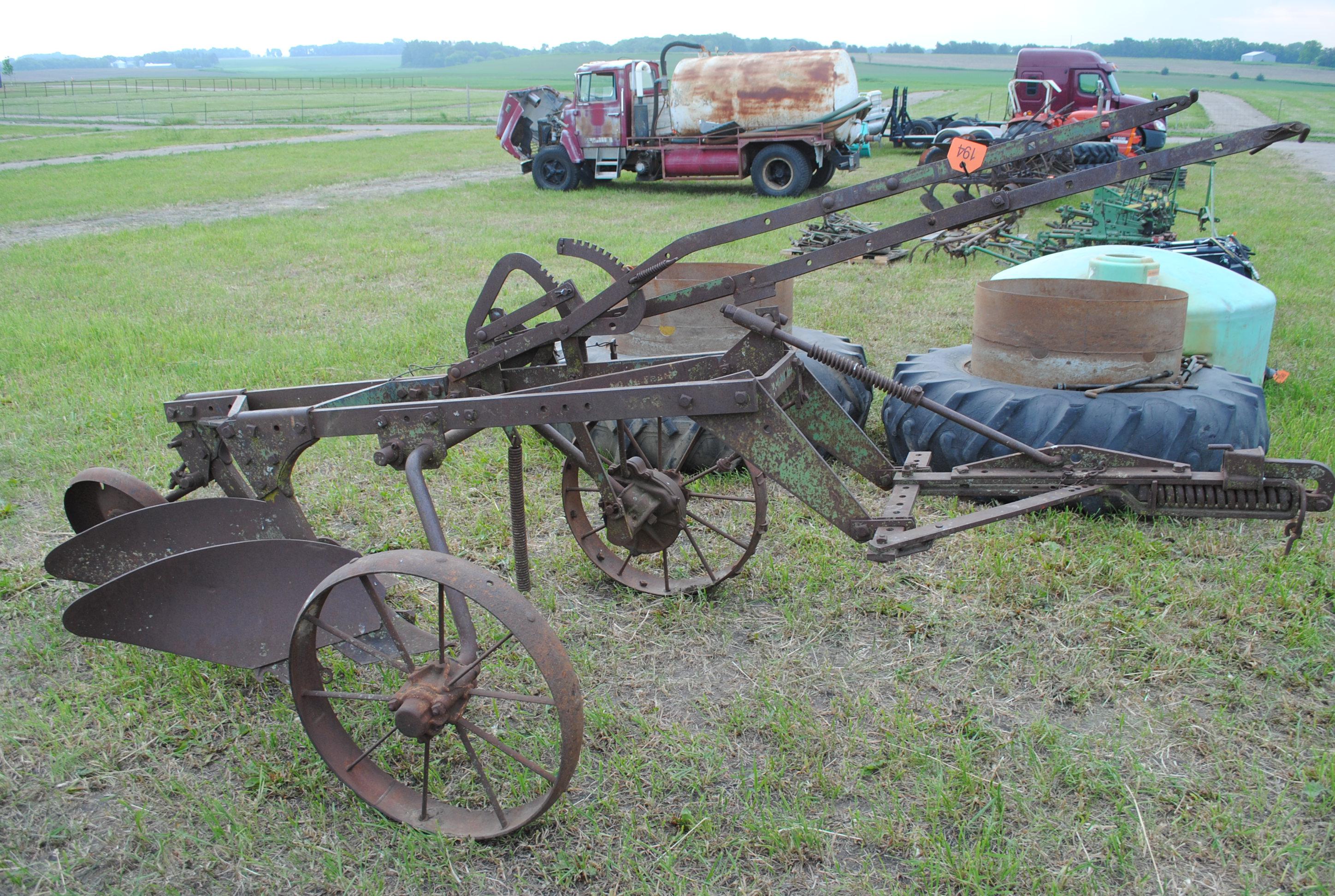 John Deere 2-14 pull-type plow on steel