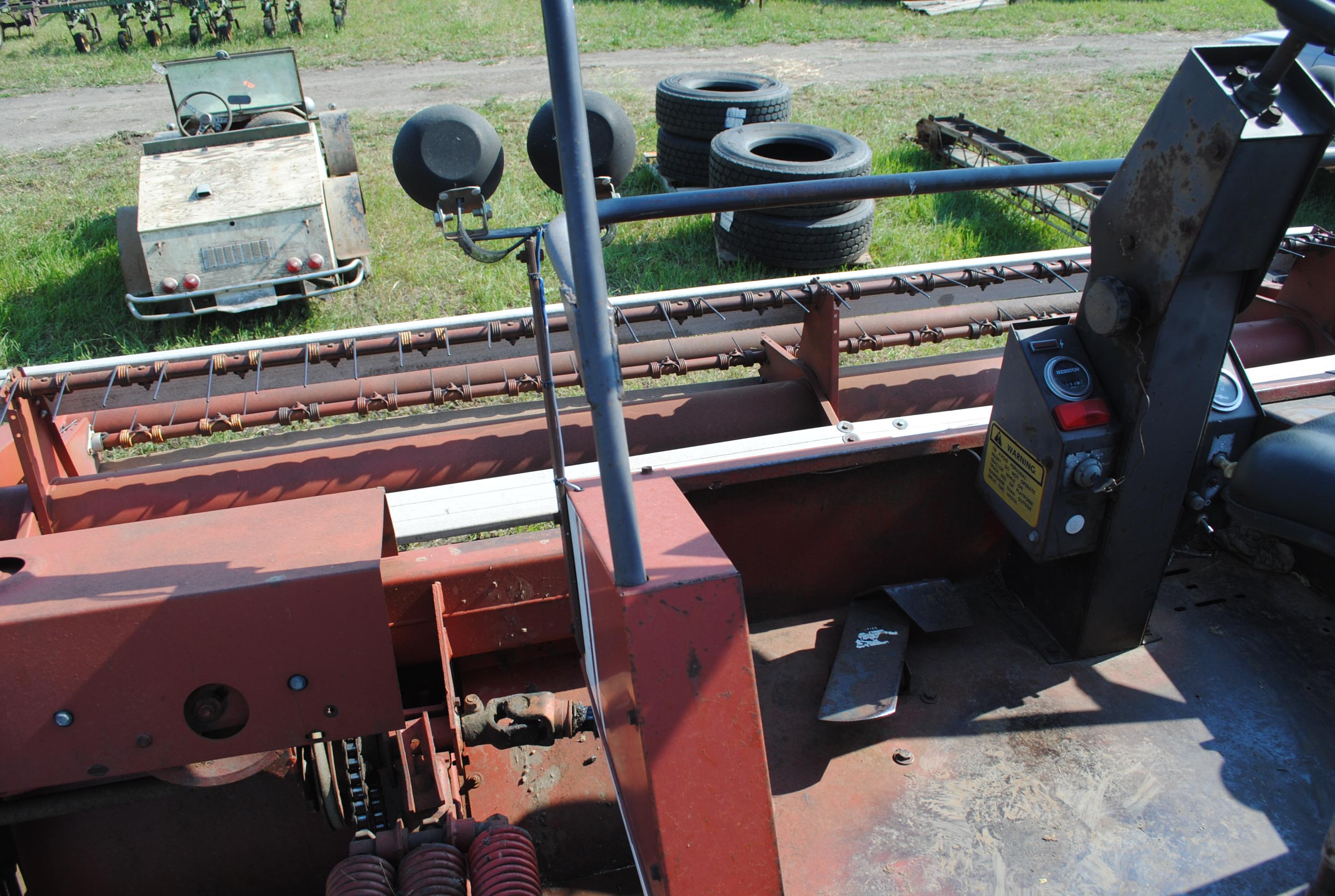Hesston 6450 12' Swather, Chrysler gas engine, crimper, shows 5,504 hours, sells with home built swa