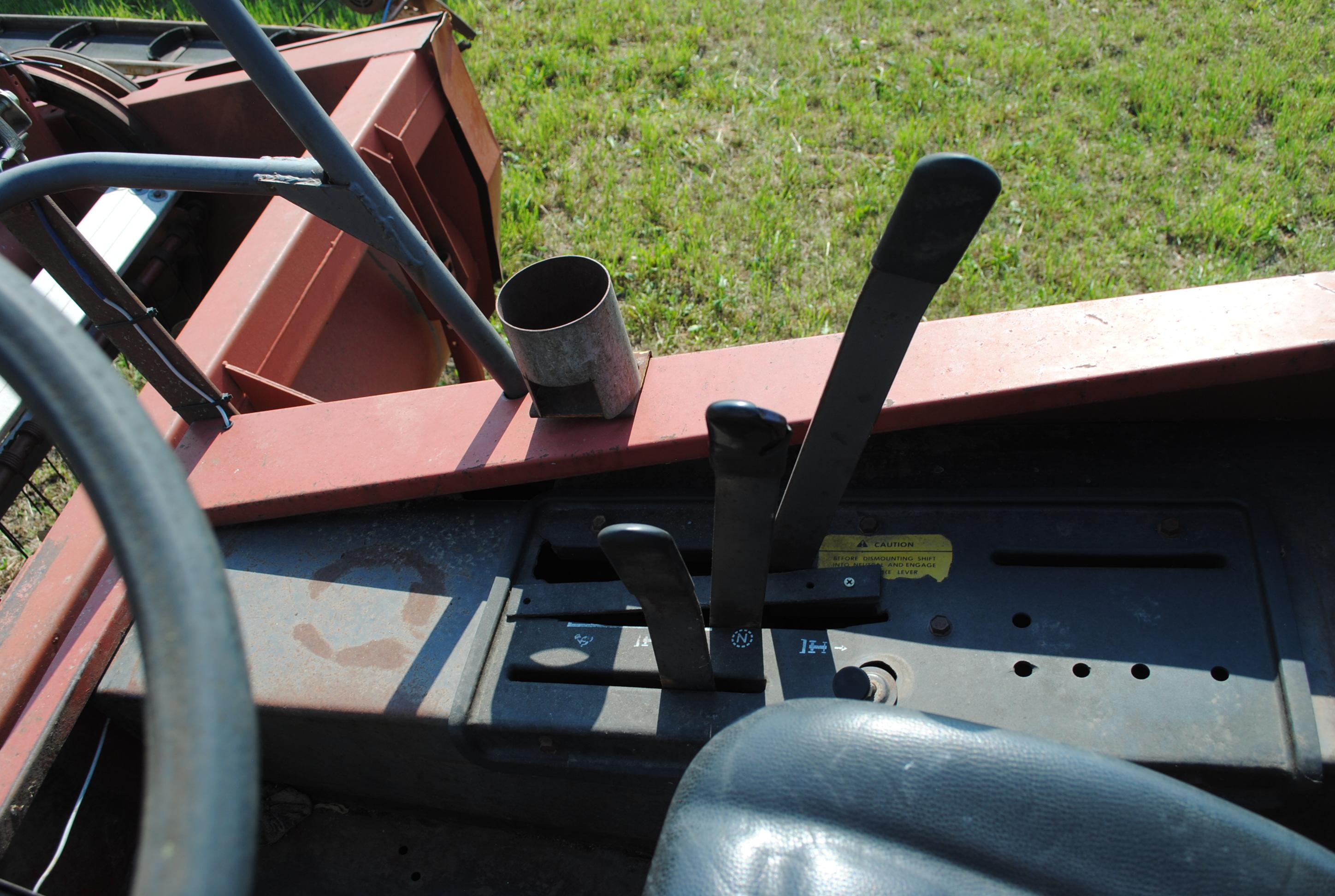 Hesston 6450 12' Swather, Chrysler gas engine, crimper, shows 5,504 hours, sells with home built swa