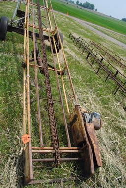 Approx. 25' bale conveyor on transport with electric motor