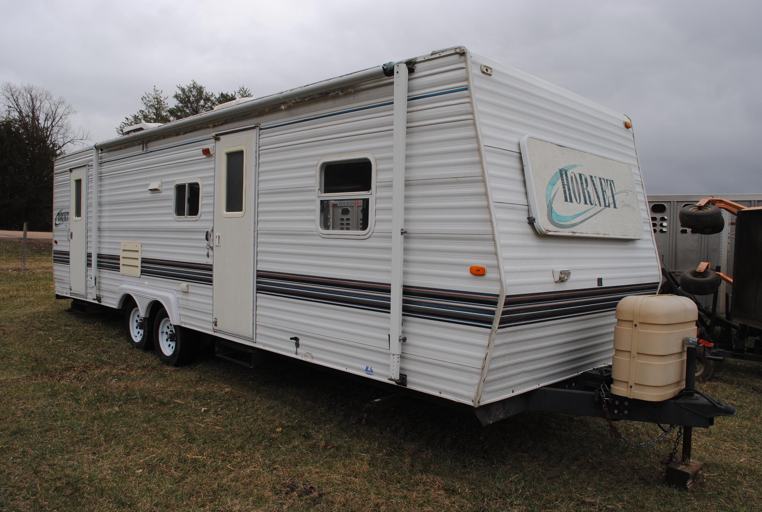 **T** 1999 Hornet Bumper pull Camper 29'x8', Queen bed in master, couch folds down into bed, dinette