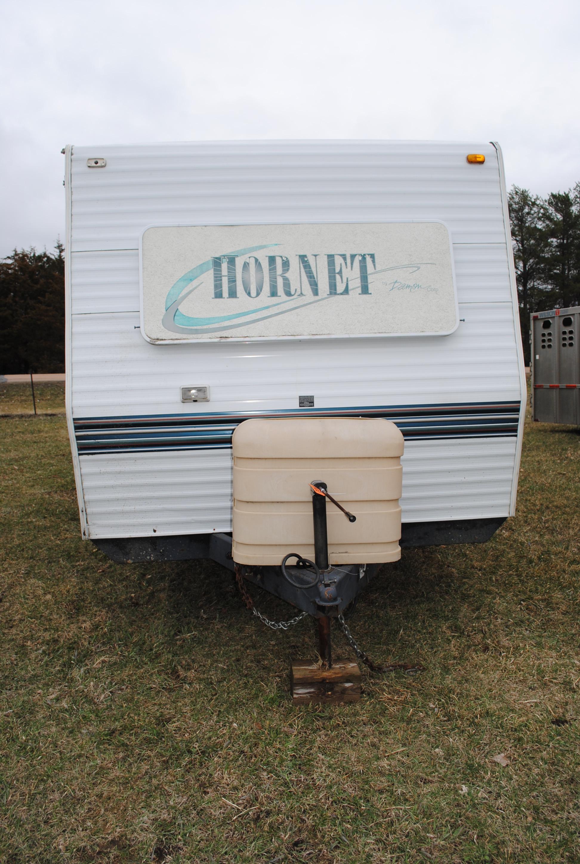 **T** 1999 Hornet Bumper pull Camper 29'x8', Queen bed in master, couch folds down into bed, dinette