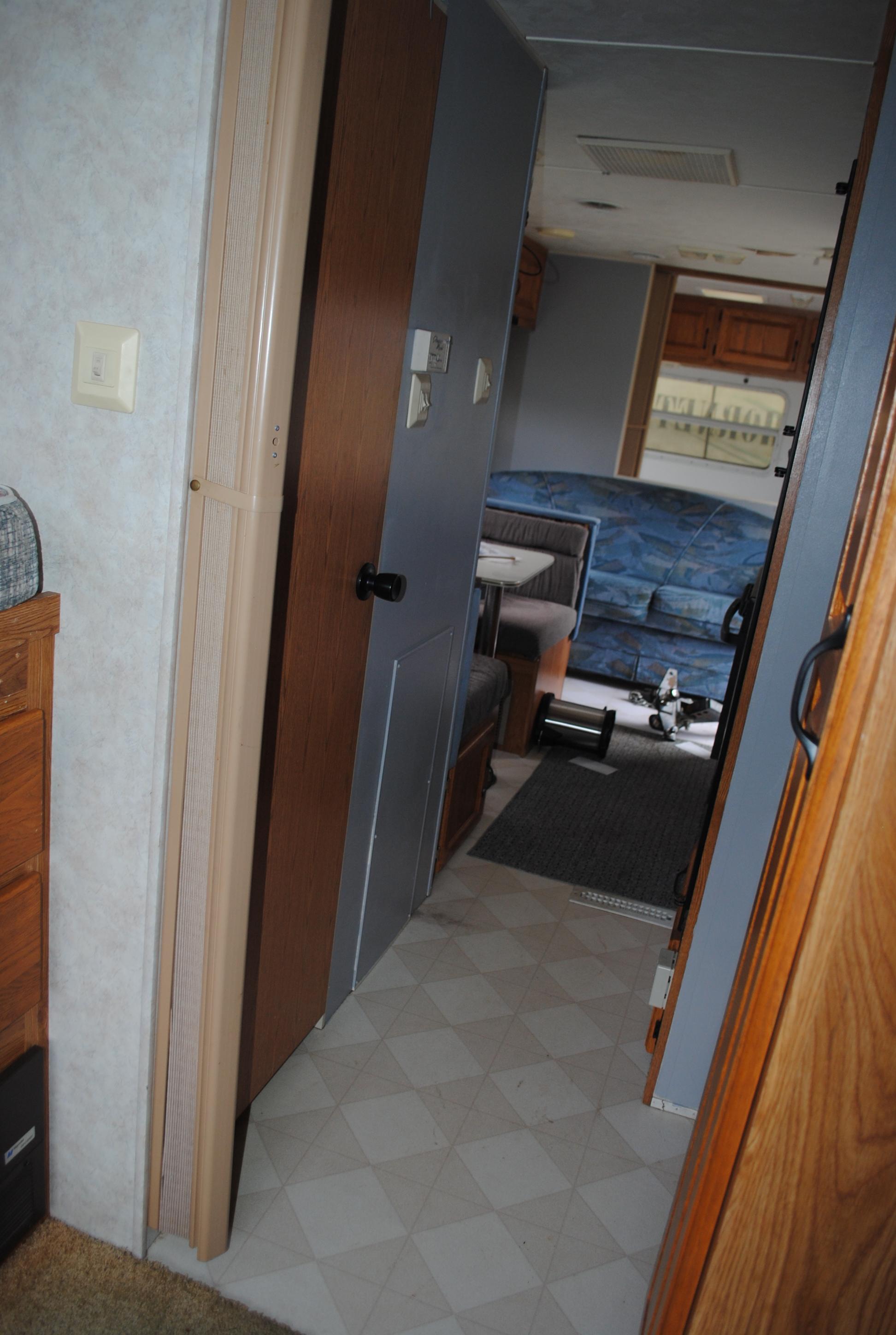 **T** 1999 Hornet Bumper pull Camper 29'x8', Queen bed in master, couch folds down into bed, dinette