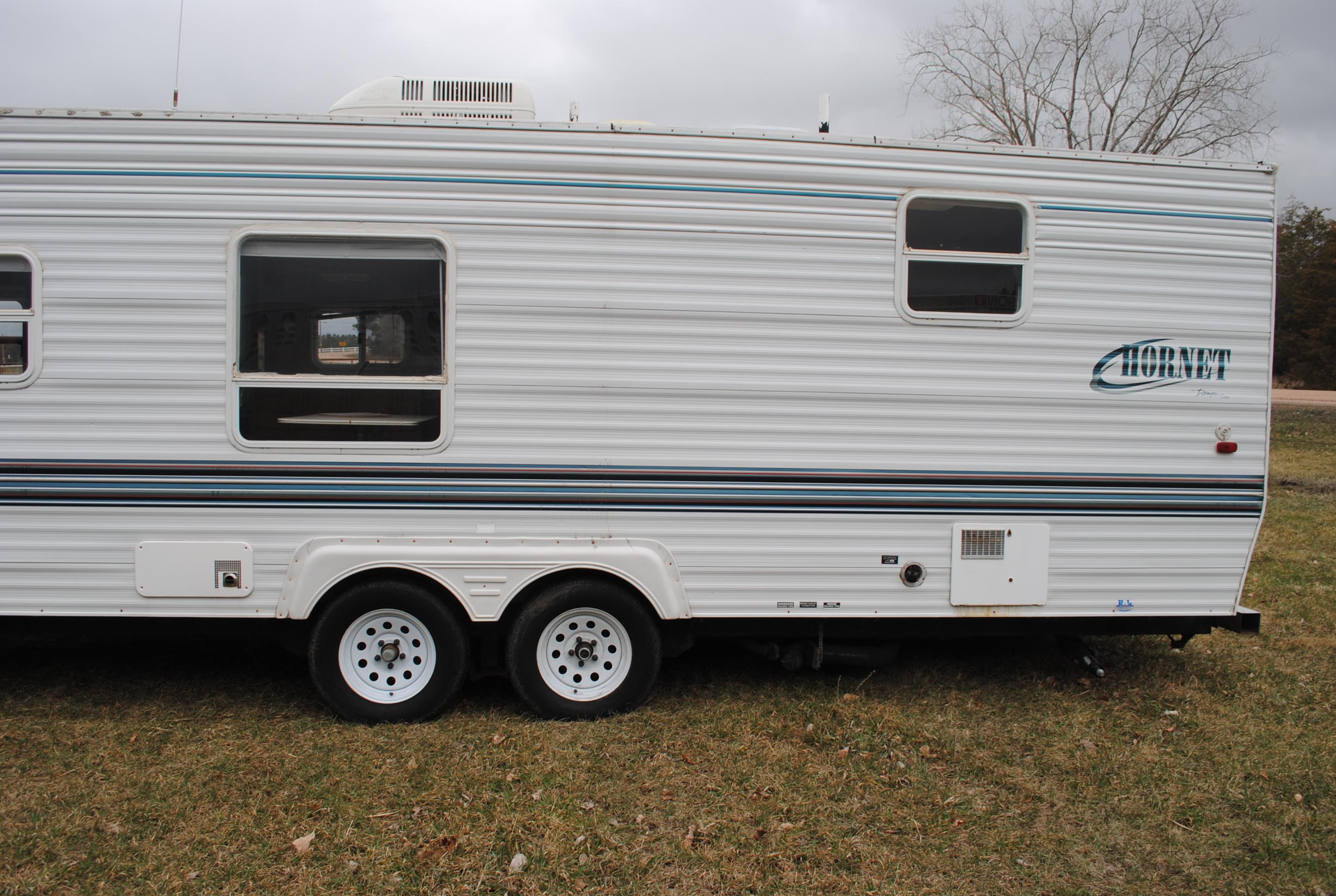 **T** 1999 Hornet Bumper pull Camper 29'x8', Queen bed in master, couch folds down into bed, dinette