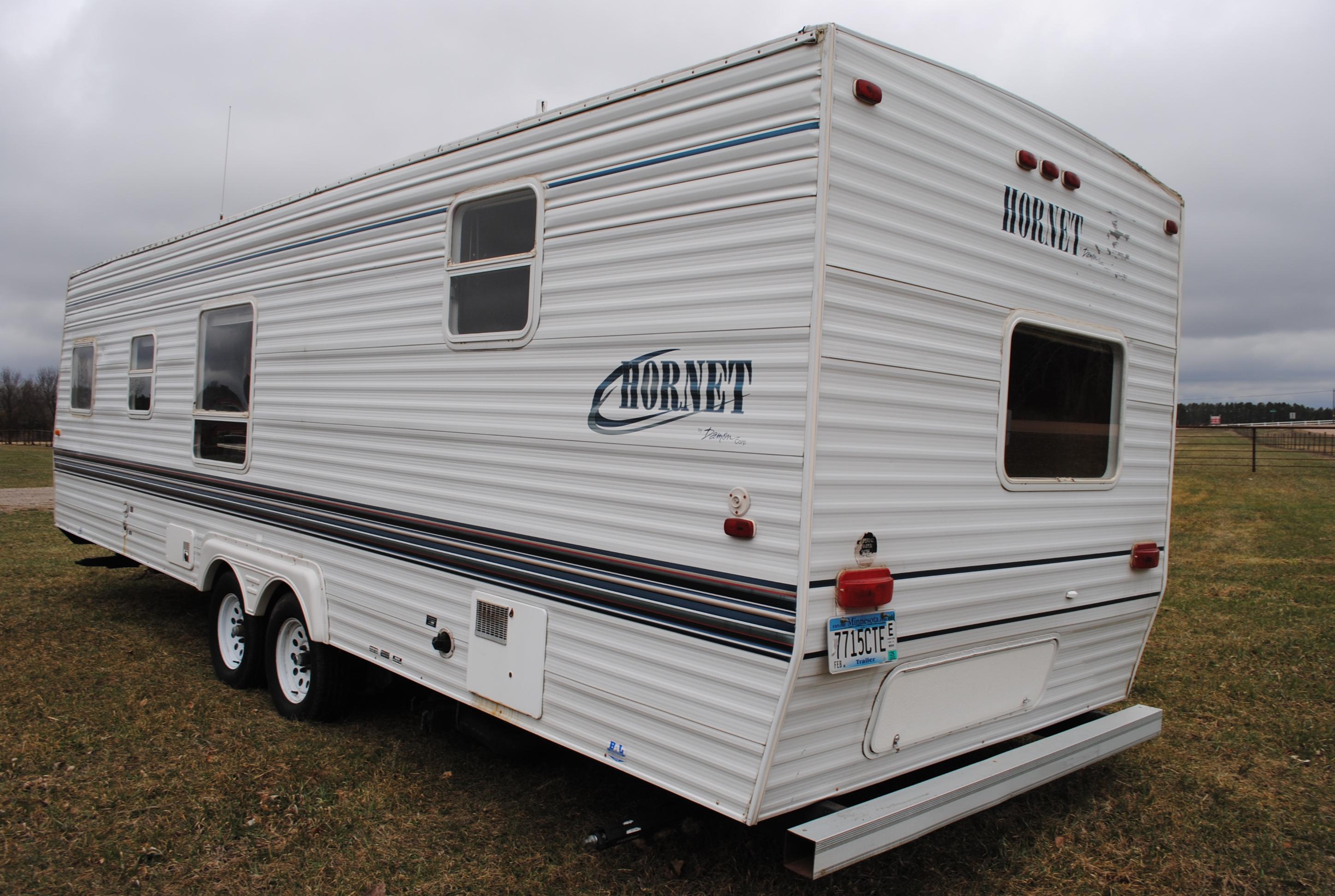 **T** 1999 Hornet Bumper pull Camper 29'x8', Queen bed in master, couch folds down into bed, dinette