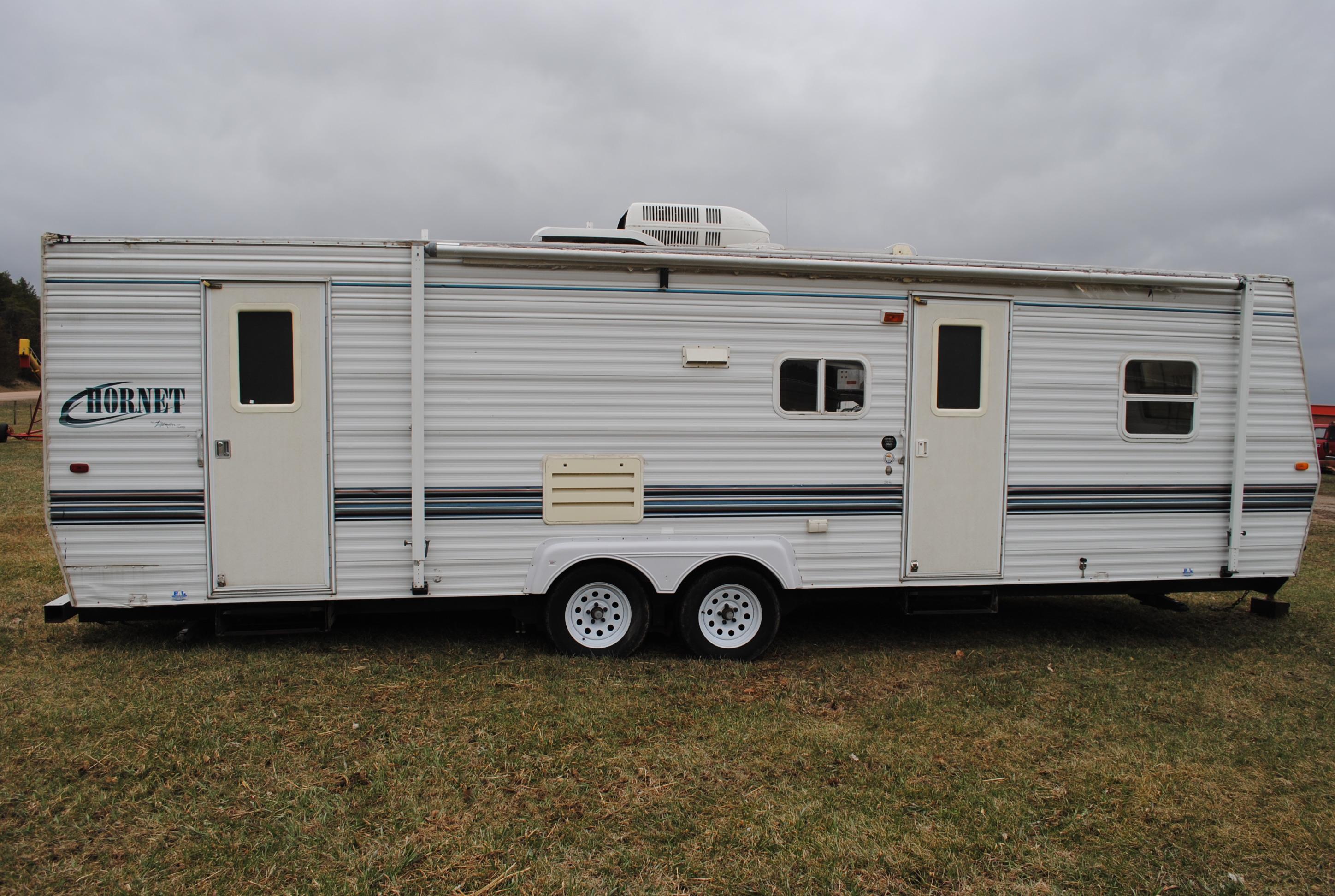 **T** 1999 Hornet Bumper pull Camper 29'x8', Queen bed in master, couch folds down into bed, dinette