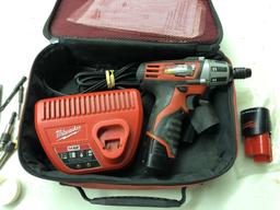 Milwaukee compact cordless driver with charger and nut driver accessories