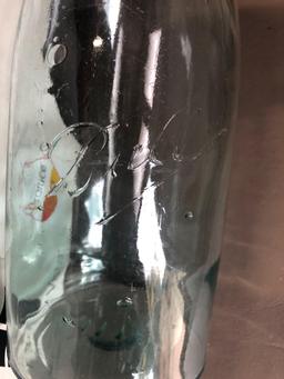 2 glass jugs with handles, large brown jar, kerosene lamp, Mexican candle holder, Mason Ball jar.