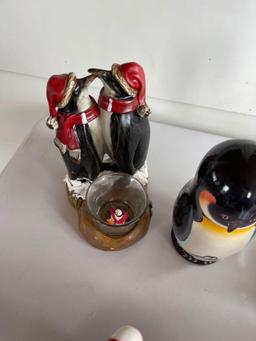 Assortment of penguin figurines.... Shipping