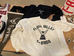 Various sized T-Birds and Floyd Valley shirts and cheerleading memorabilia