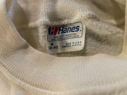 Various sized T-Birds and Floyd Valley shirts and cheerleading memorabilia