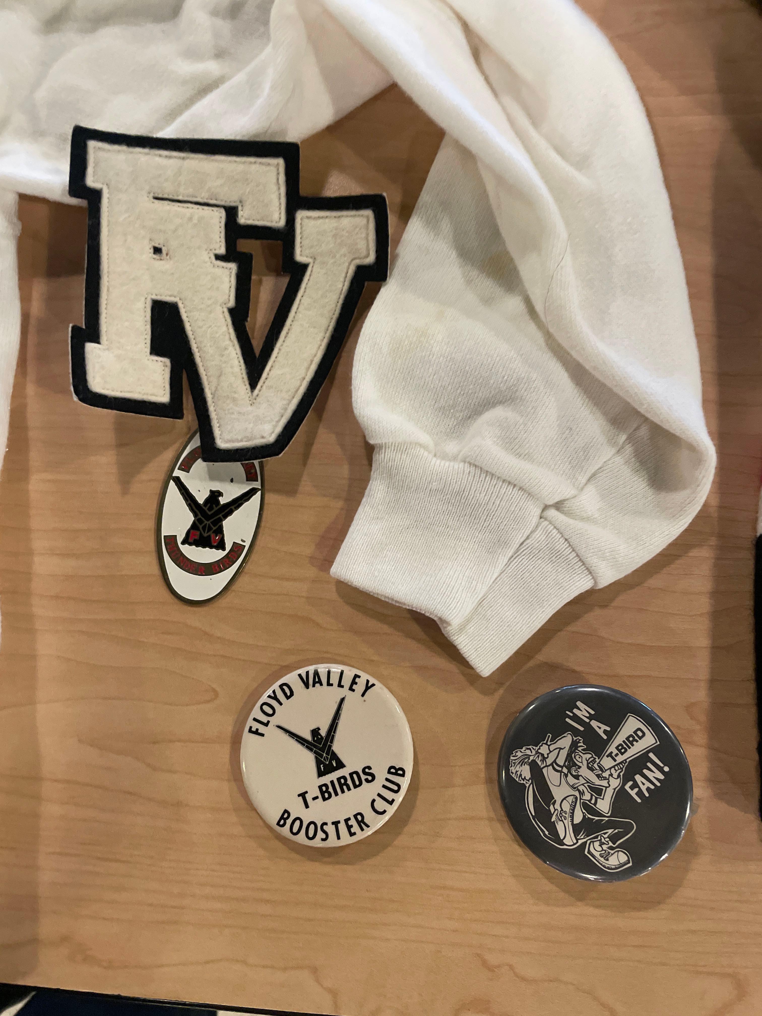Various sized T-Birds and Floyd Valley shirts and cheerleading memorabilia