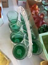 Eight matching glasses in metal carrier. Shipping...