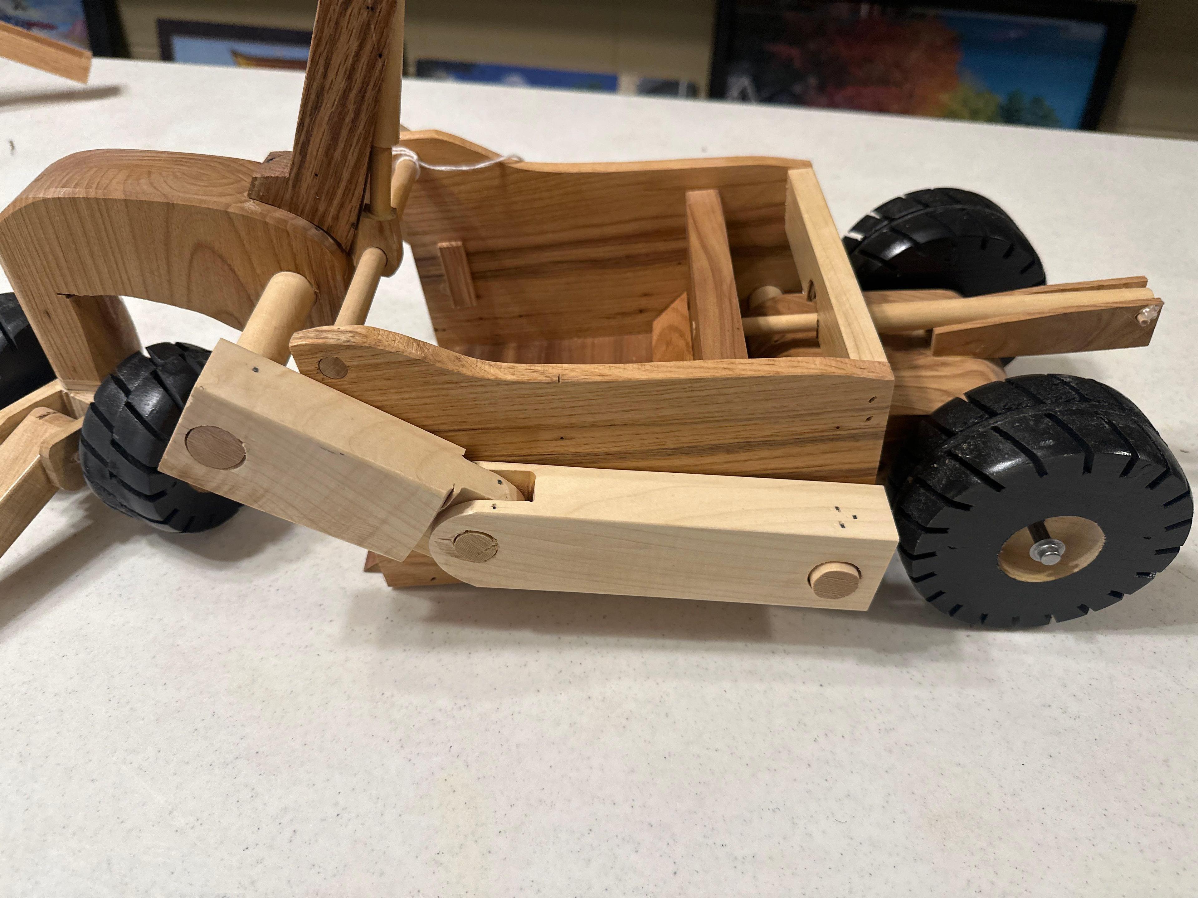 Handcrafted wood dirt scraper
