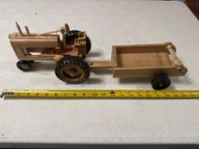 Handcrafted wood tractor and man