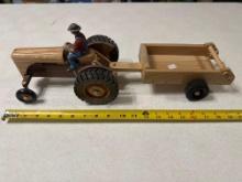 Handcrafted wood tractor with man and manure spreader