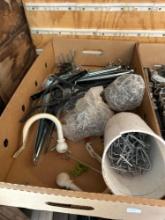box of various pegboard hooks, barb wire steel post clips, 14" pipe wrench, hatchet, fiberglass claw