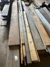 Assorted lumber of various sizes, assorted plastic decking planks,