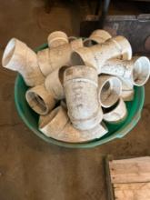 Tub of large PVC fittings