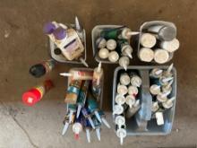 Assorted caulk and paint cans