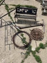 Assorted yard and deck decorations, roll of barbed wire, weather vane, etc