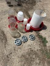 Assorted chicken waters and feeders