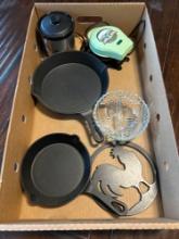 Cast iron skillets, yoda waffle maker, small crock pot, chicken decoration
