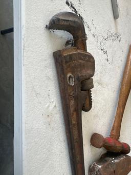 Large fiberglass handle hammer, ball peen, hammer, pipe wrenches.