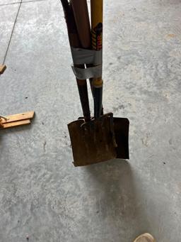 Potato fork and two flat sand shovels.