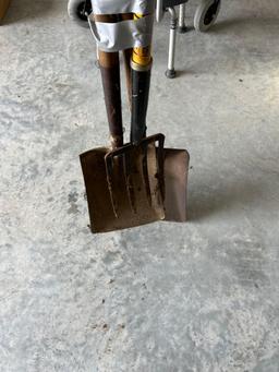 Potato fork and two flat sand shovels.