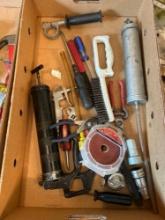 Box of assorted screw drivers, grease guns, sanding pads,