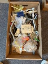 Box of assorted plumbing supplies, shower fittings and drains, stainless flex pipe etc