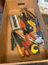 Box of assorted tools, tape measure, crescent wrench, pliers