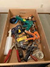 Box of assorted tools, caulk guns, 16" chainsaw chain, clippers, wrenches