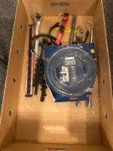 Box of assorted tools, ratchet, socket holder, rubber strap, band saw blade