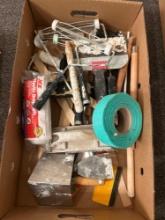 Box of assorted painting and taping supplies