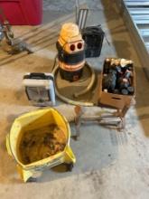 Shop vac, milkhouse heaters, assorted oils, lubricants, and vintage work lamp
