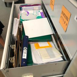 Drawer full of office supplies