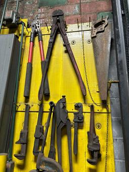 Wall of Pipe Cutters, Pipe Wrenches, and Bolt Cutters