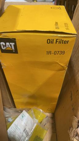 Box of John Deere & CAT oil filters