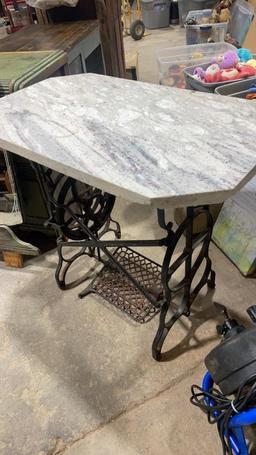 Antique sewing machine base with marble top