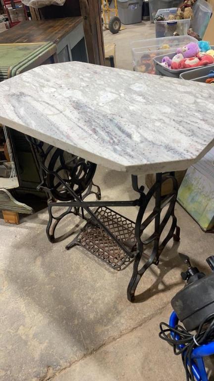 Antique sewing machine base with marble top