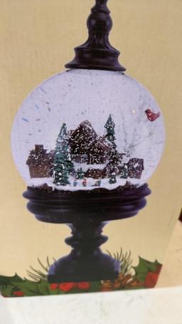 Pedestal snow globe