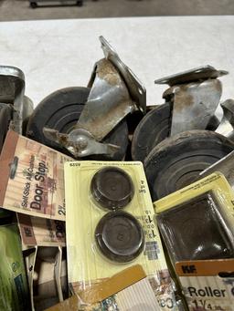 Box of misc roller casters,caster cups & door